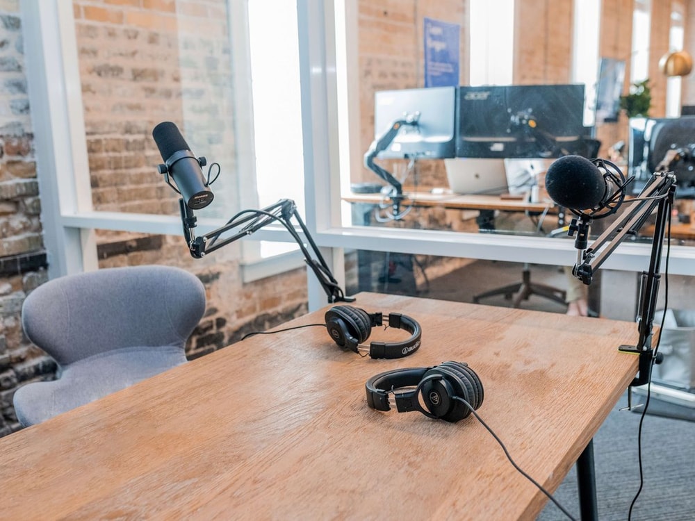 A microphone set up in a home studio, symbolizing the start of a podcast episode focused on marketing strategies.