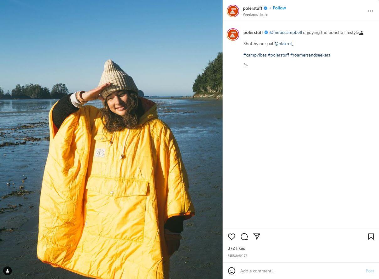 A women wearing a giant yellow poncho