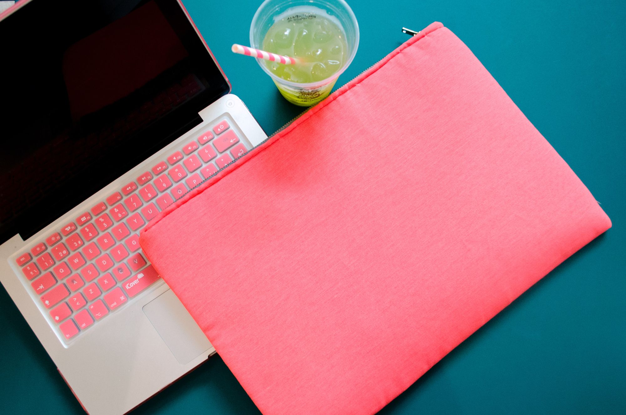 A laptop with a pink keyboard and matching pink case