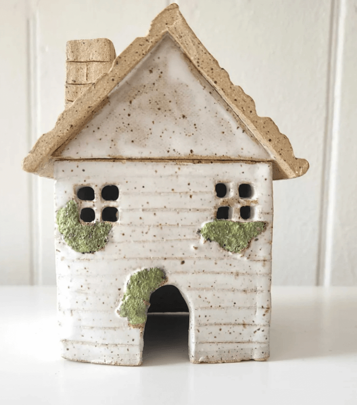 A small tea cottage made from clay