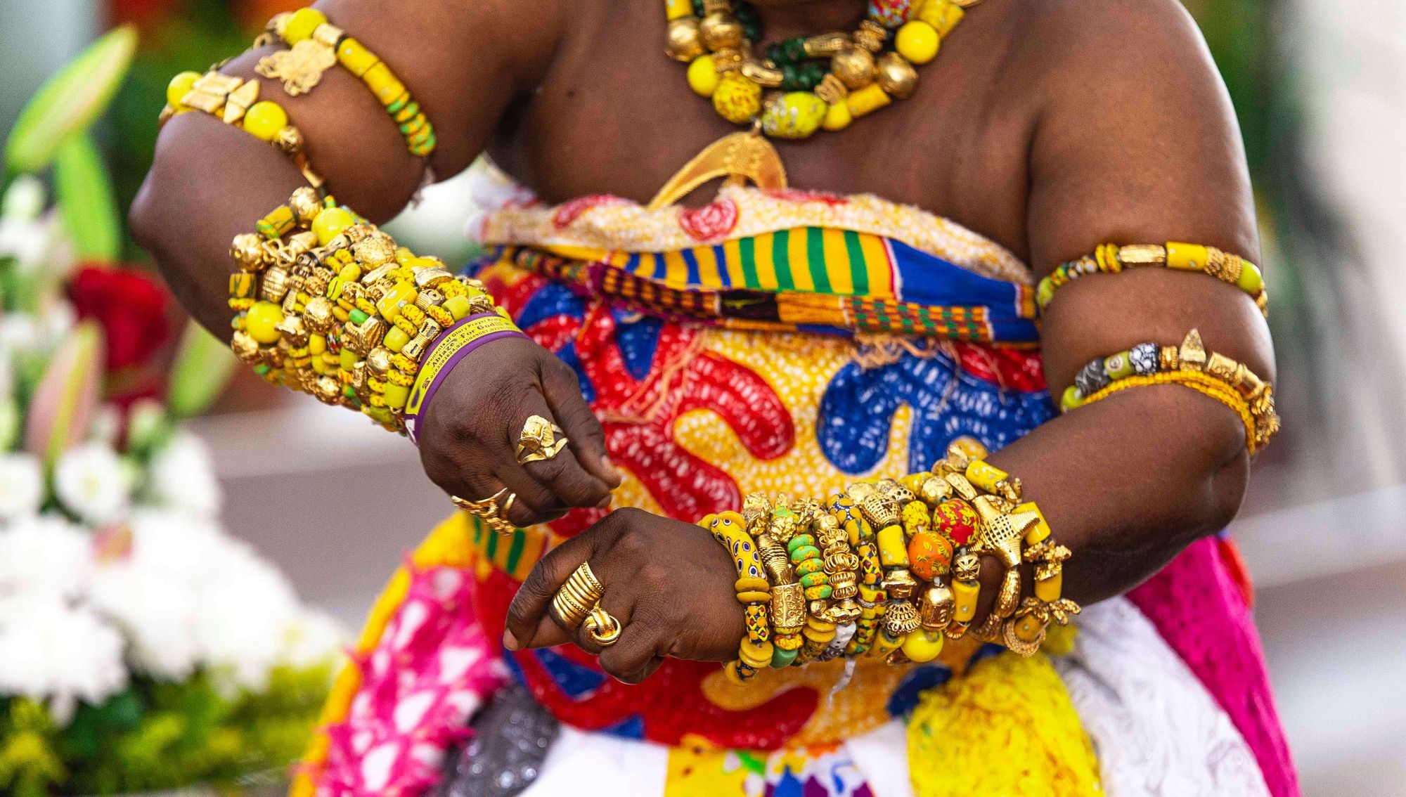 A woman adorned in traditional beads typically for festival or other indigenous celebrations in Ghana