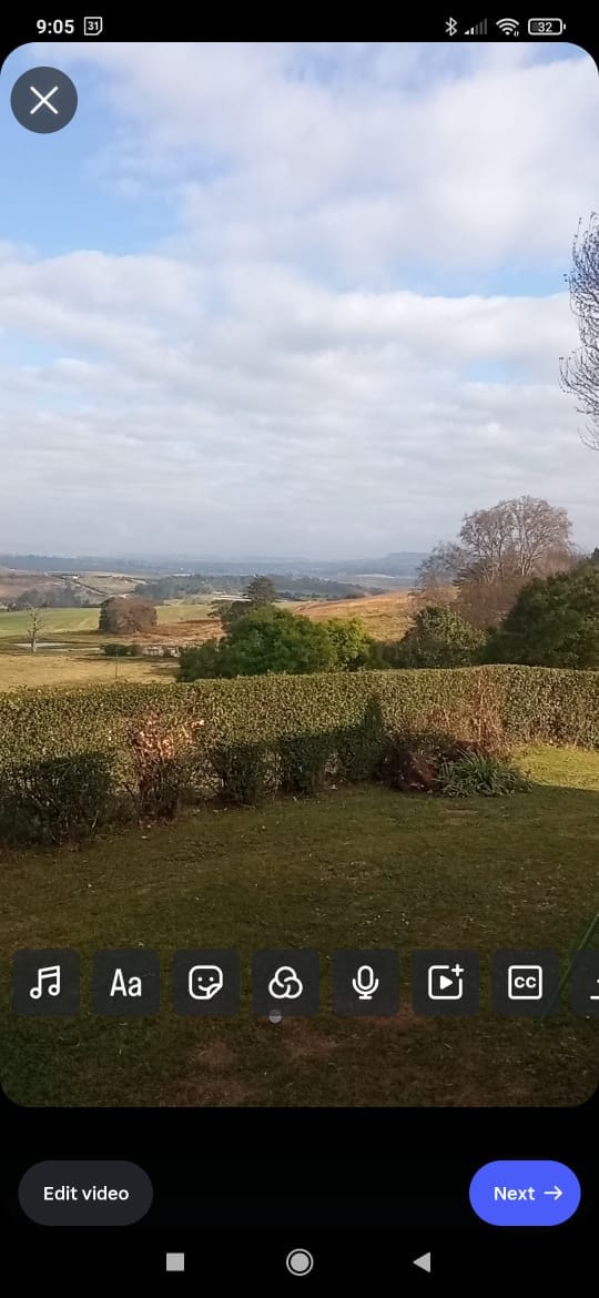 Instagram's capture window, with a green field visibly in the viewfinder