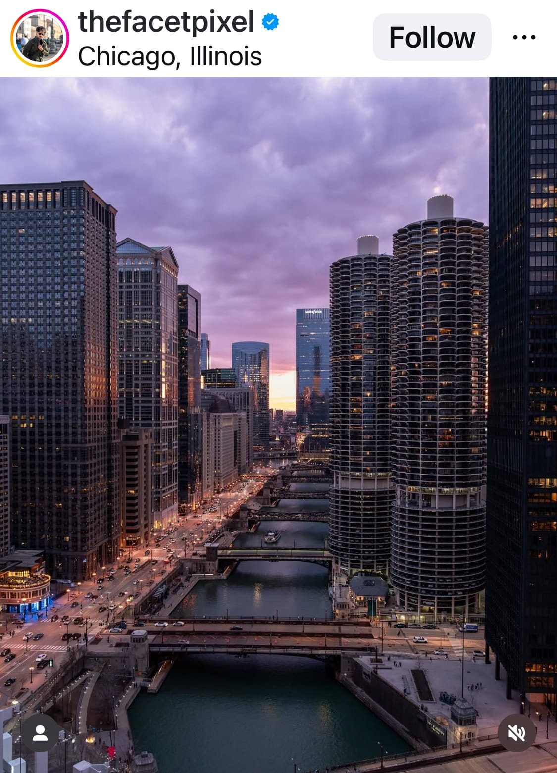 Alt text: Aerial photo of downtown Chicago at sunset, showing the river, bridges, and skyscrapers including Marina City towers, under a purple and orange sky.