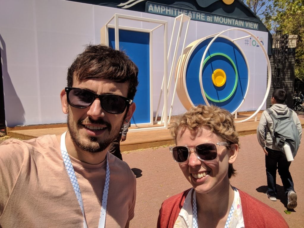 Joe and Victoria at Google I/O in front of a giant IO structure