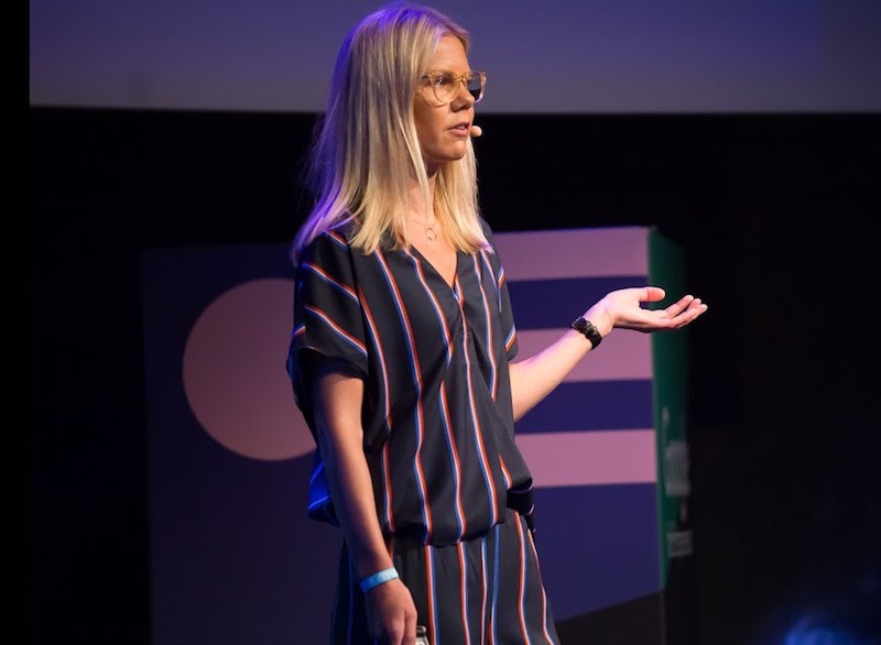 A buffer employee speaking at a conference